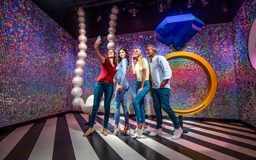 Visitors taking a selfie with Kylie Jenner wax figure at Madame Tussauds Dubai.