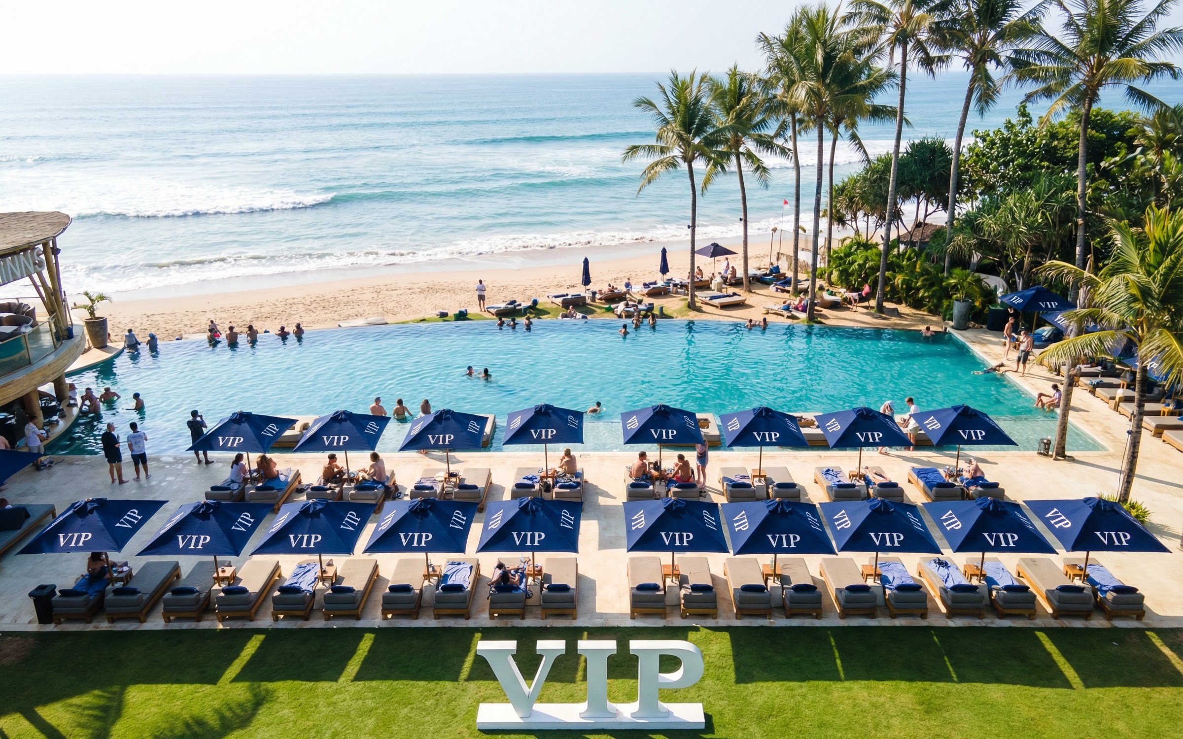 VIP area at Finn's Beach Club with poolside loungers and ocean view in Bali.