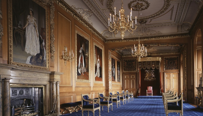 Windsor Castle Garter Throne Room with ornate chandeliers and royal portraits.