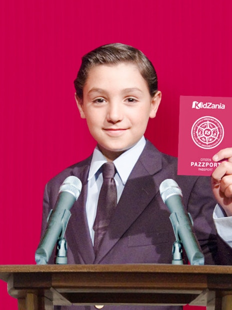 Child holding KidZania Singapore passport at podium with microphones.