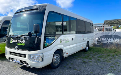Bruny Island Safaris tour bus parked in Hobart for Bruny Island full-day guided tour.