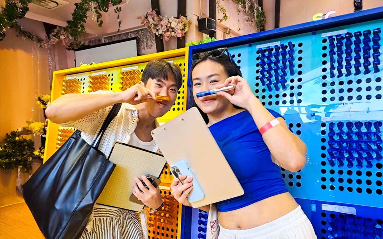 Visitors enjoying scent experience at Scentopia, Sentosa attractions.
