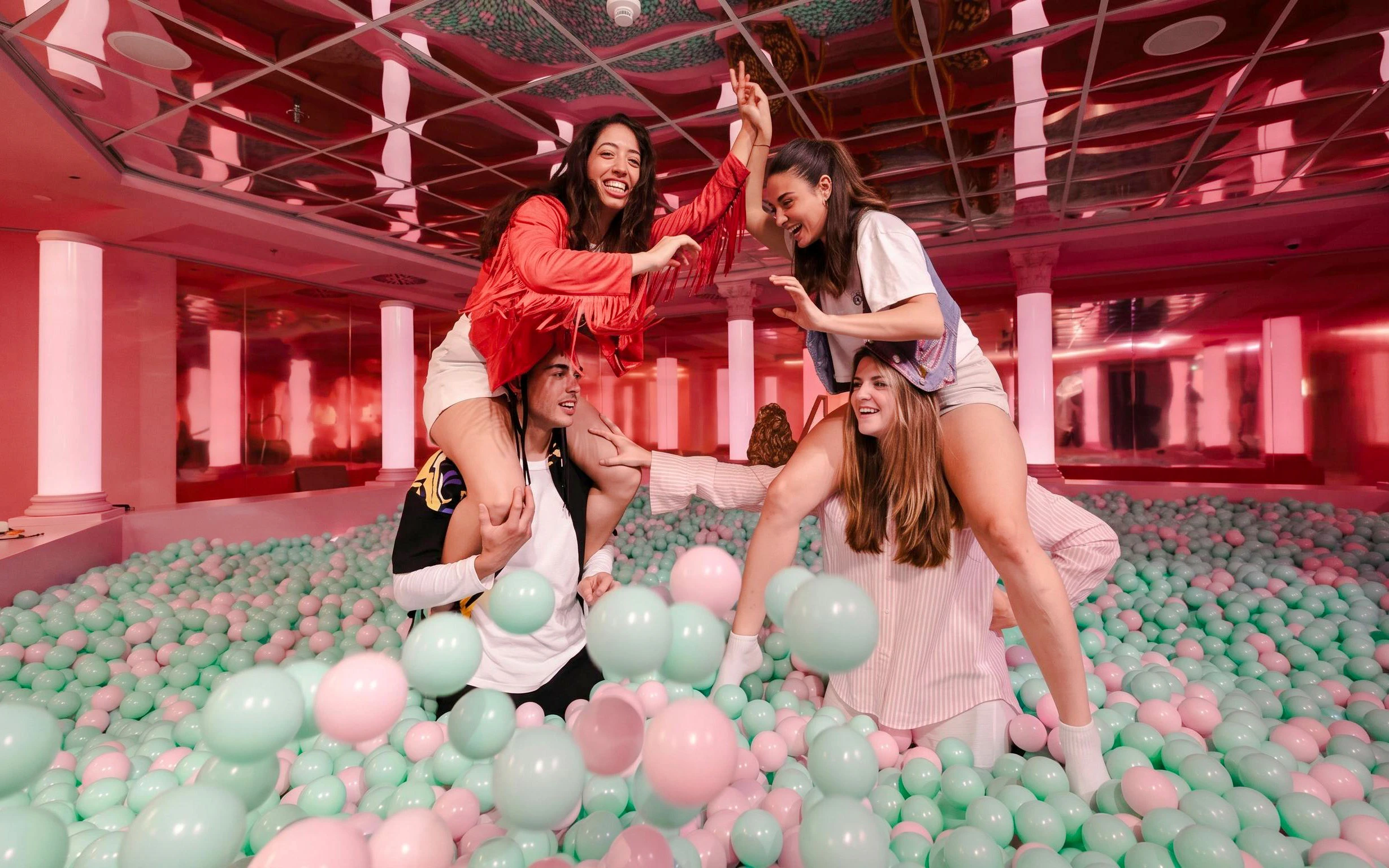 Guests enjoying a ball pit at The Upside Down Berlin.