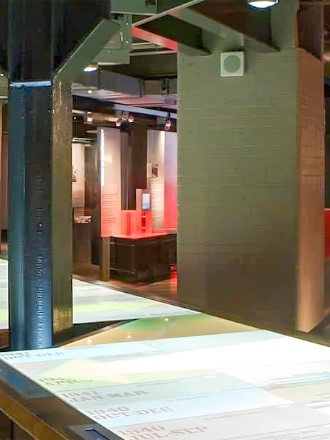 Interactive exhibit in Churchill War Rooms, London, showcasing historical documents.