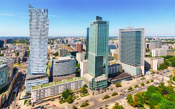 Warsaw cityscape with modern skyscrapers on a guided tour with hotel transfers.