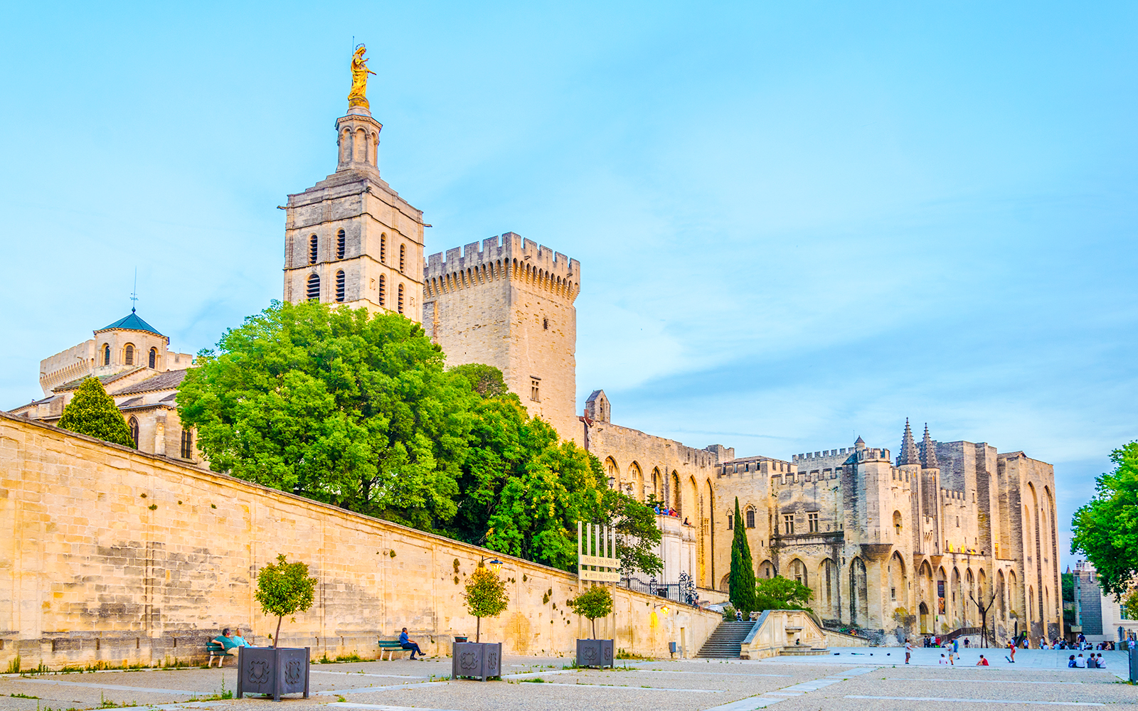 Palais des Papes and Avignon Cathedral with surrounding courtyard in Avignon, France.