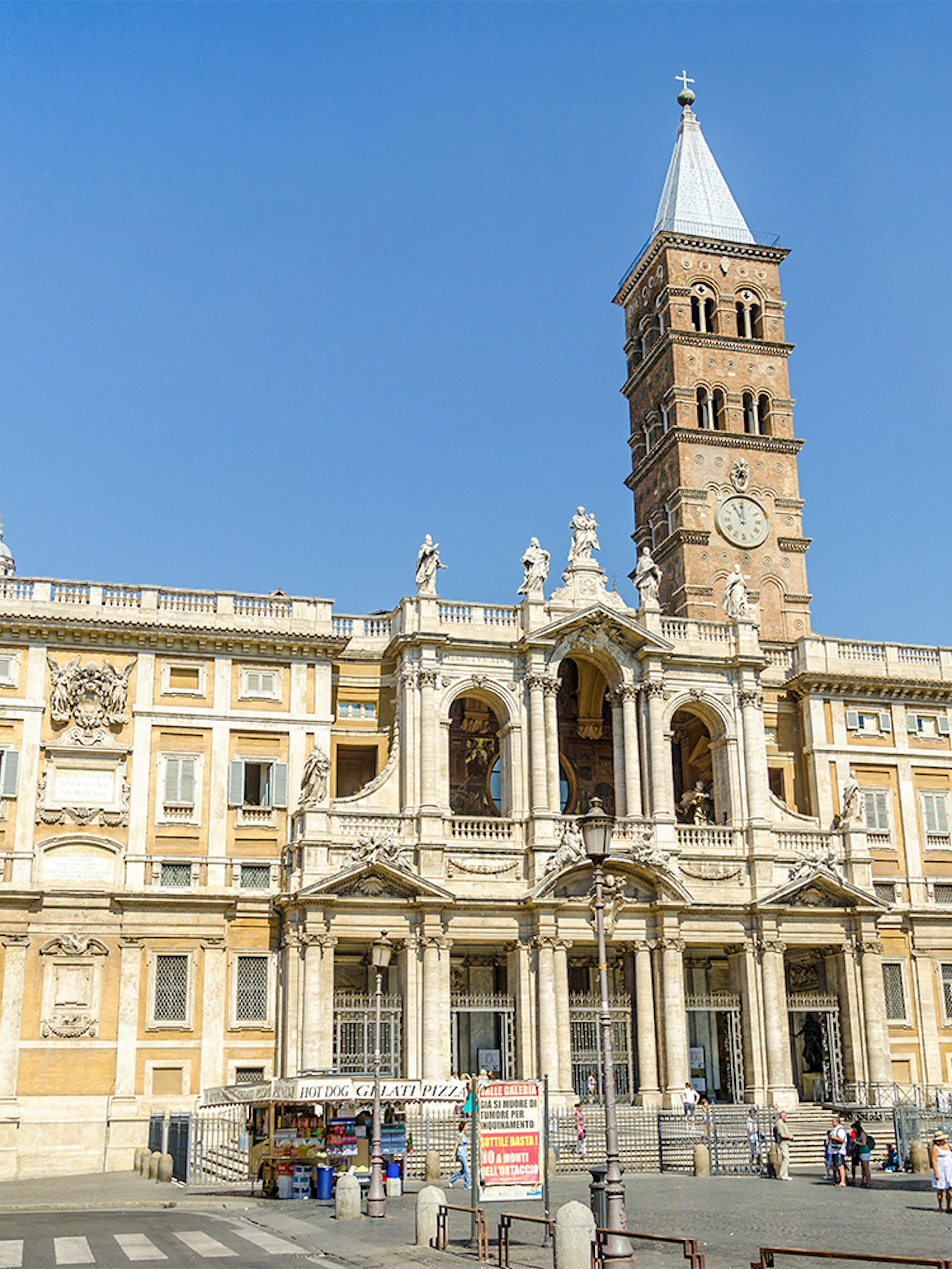 Basilica Santa Maria Maggiore facade with visitors in Rome, Italy.