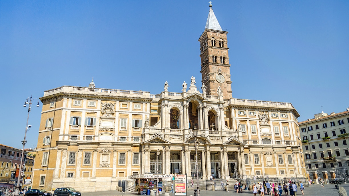 Basilica Santa Maria Maggiore facade with visitors in Rome, Italy.