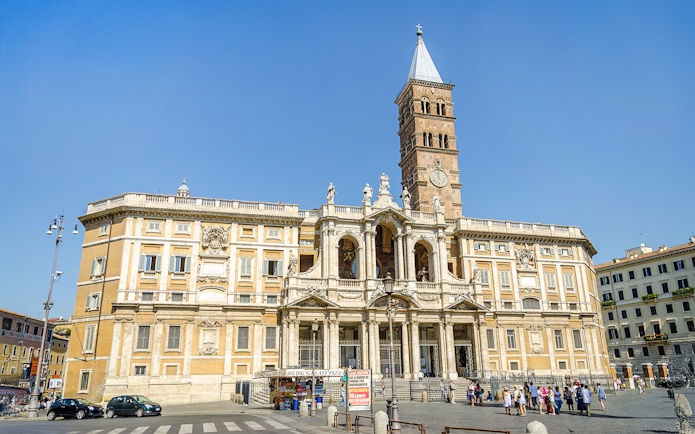 Basilica Santa Maria Maggiore facade with visitors in Rome, Italy.
