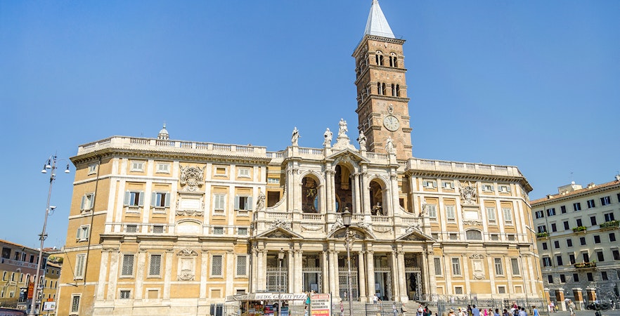 Basilica Santa Maria Maggiore facade with visitors in Rome, Italy.