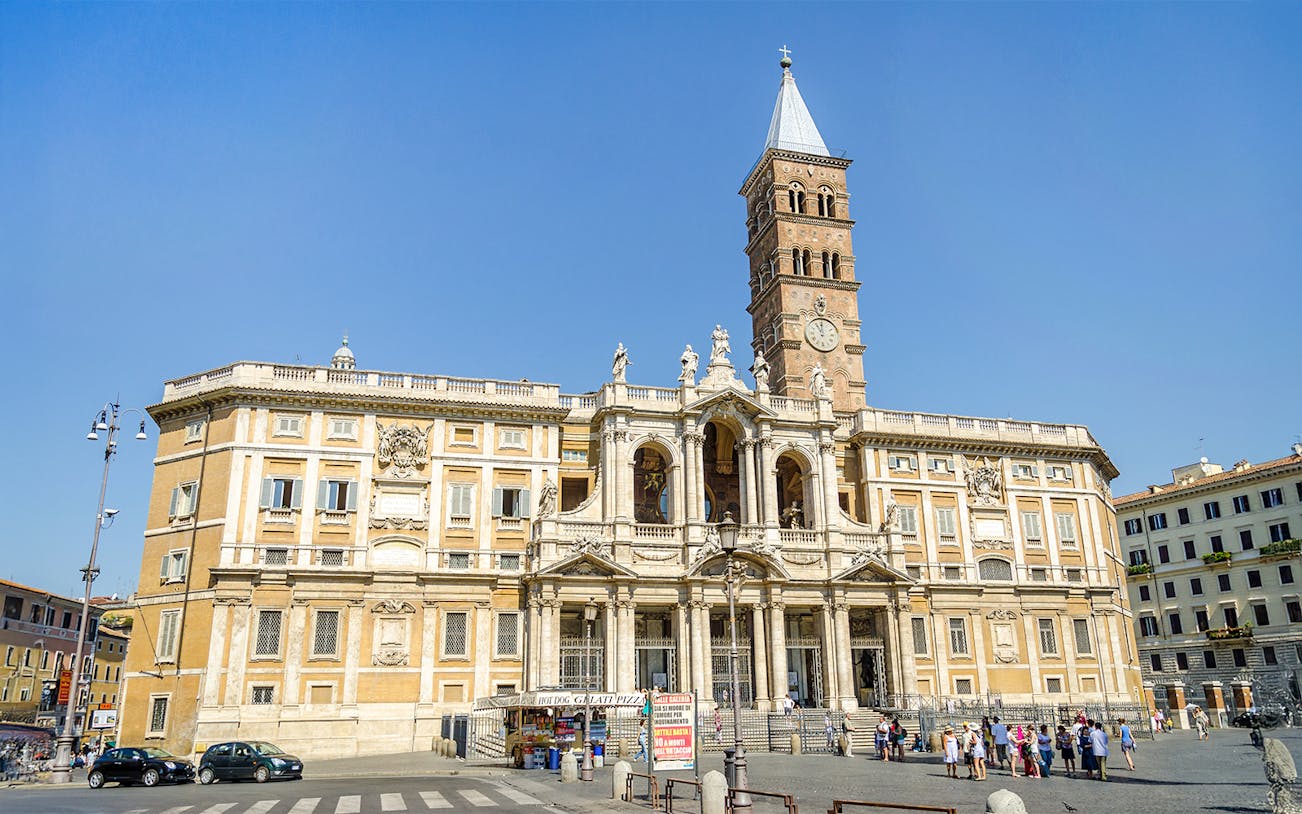 Basilica Santa Maria Maggiore facade with visitors in Rome, Italy.