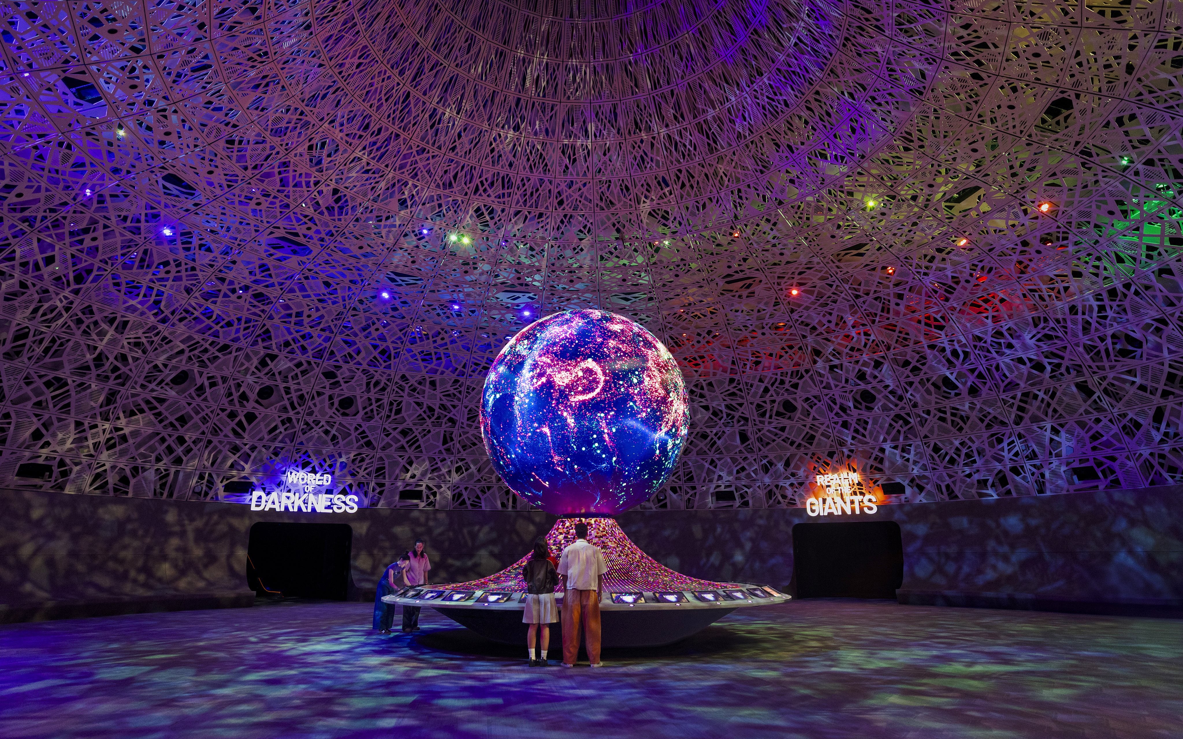 Interactive exhibit with illuminated globe at Biopool in Exploria, Mandai Wildlife.