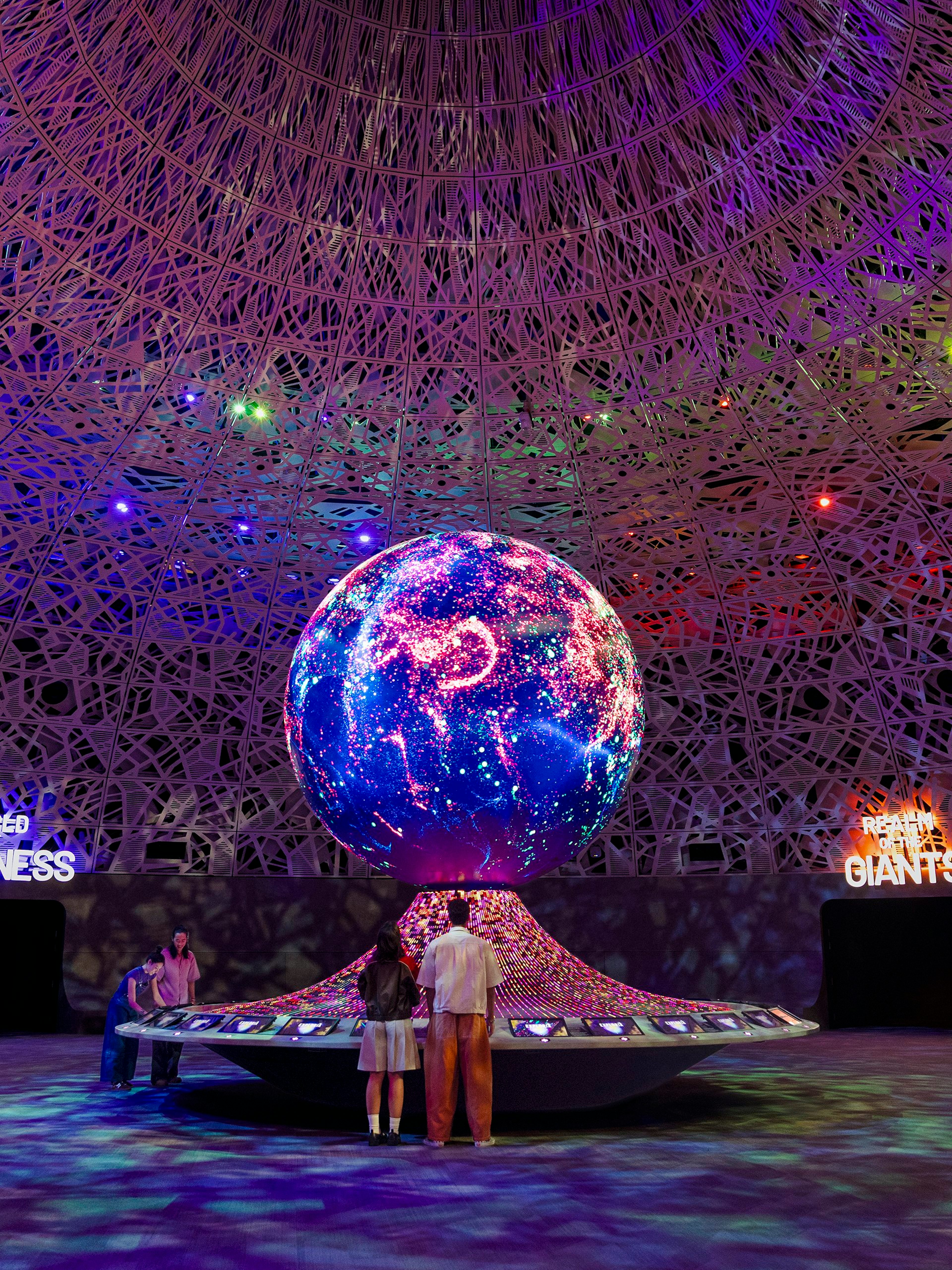 Interactive exhibit with illuminated globe at Biopool in Exploria, Mandai Wildlife.