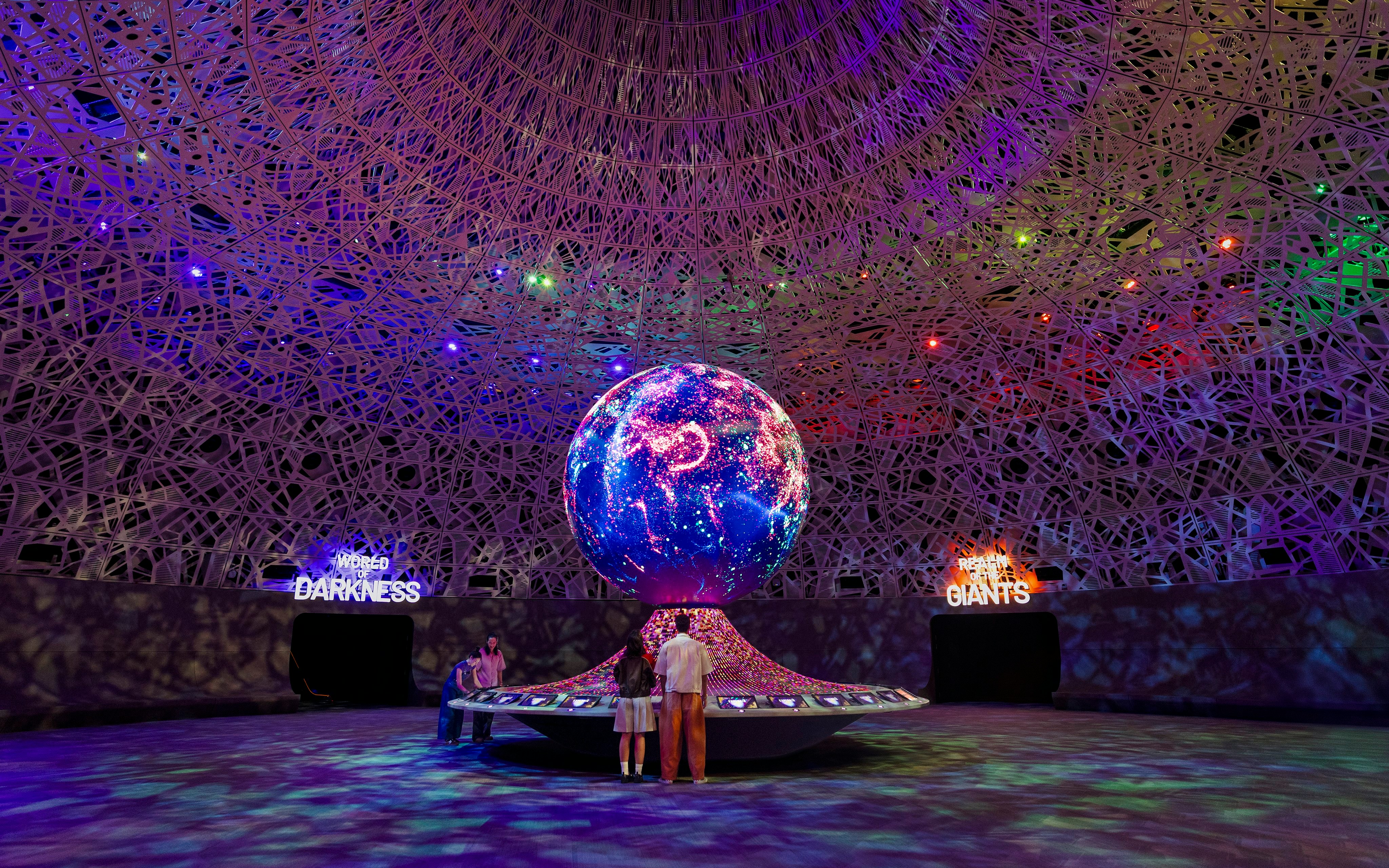 Interactive exhibit with illuminated globe at Biopool in Exploria, Mandai Wildlife.