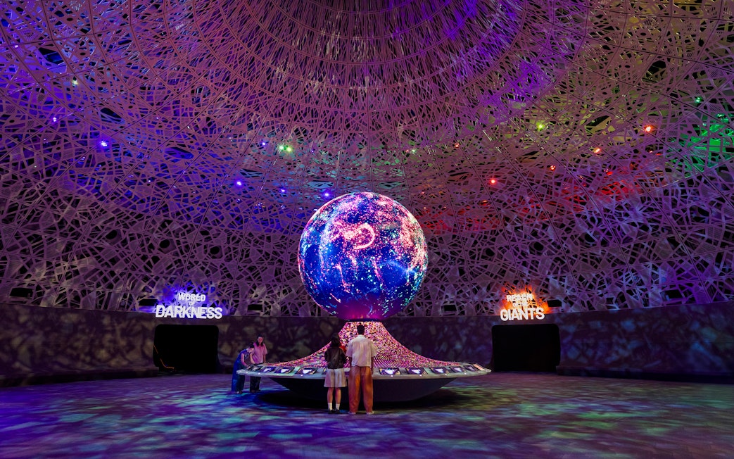 Interactive exhibit with illuminated globe at Biopool in Exploria, Mandai Wildlife.