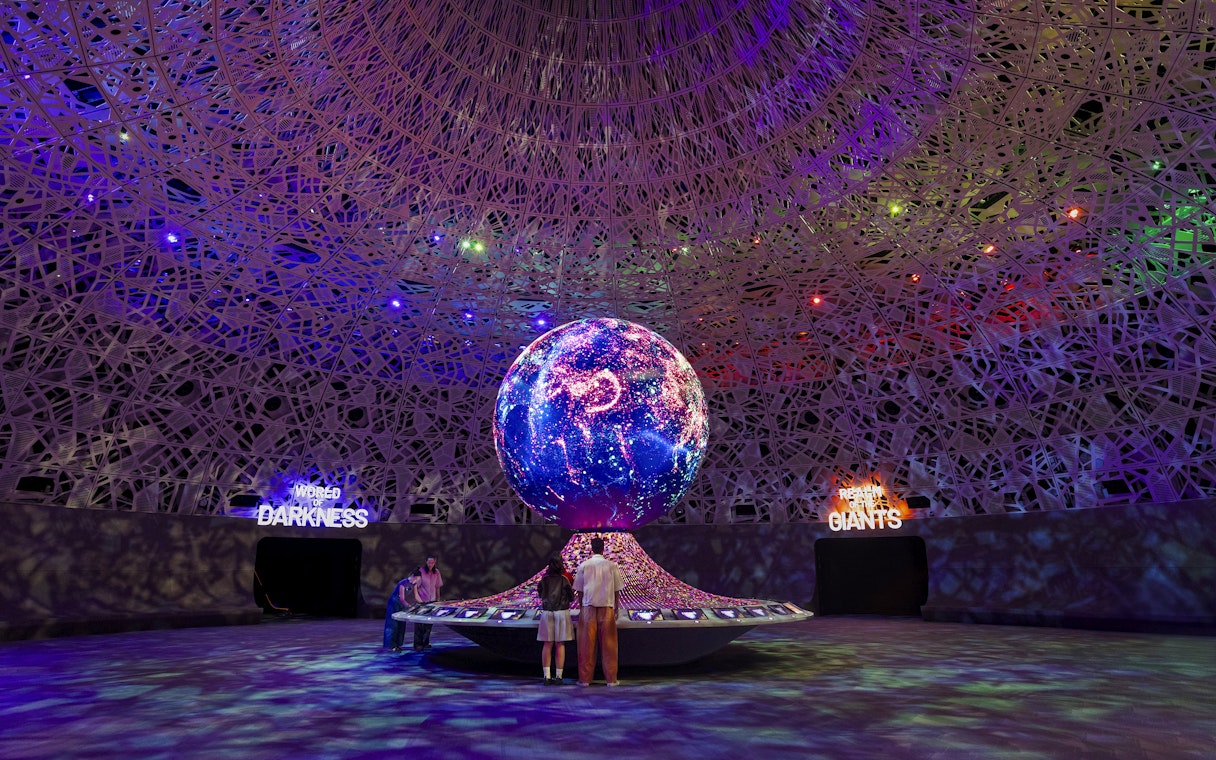 Interactive exhibit with illuminated globe at Biopool in Exploria, Mandai Wildlife.