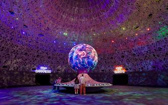 Interactive exhibit with illuminated globe at Biopool in Exploria, Mandai Wildlife.