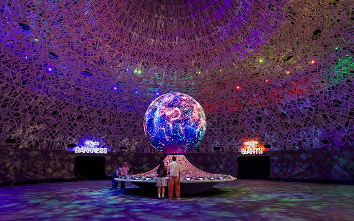 Interactive exhibit with illuminated globe at Biopool in Exploria, Mandai Wildlife.