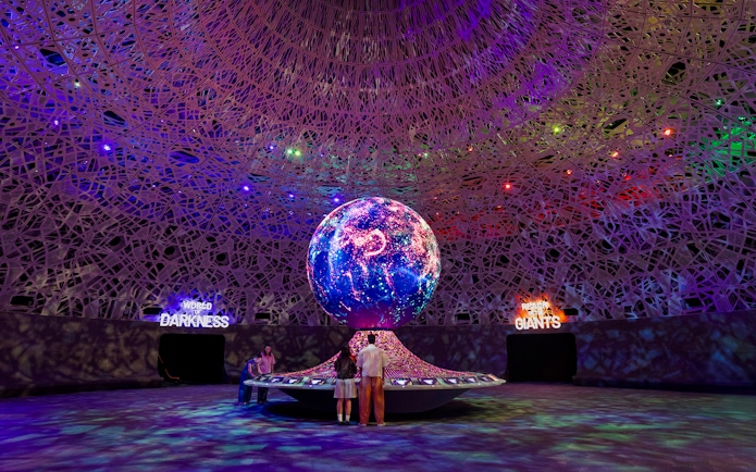 Interactive exhibit with illuminated globe at Biopool in Exploria, Mandai Wildlife.