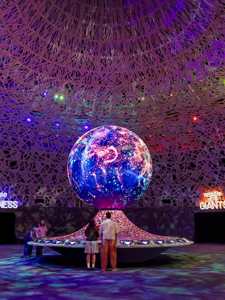 Interactive exhibit with illuminated globe at Biopool in Exploria, Mandai Wildlife.