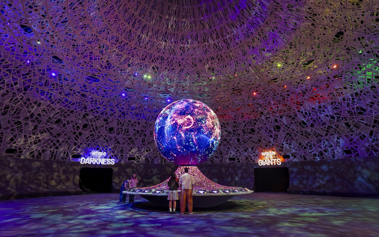 Interactive exhibit with illuminated globe at Biopool in Exploria, Mandai Wildlife.