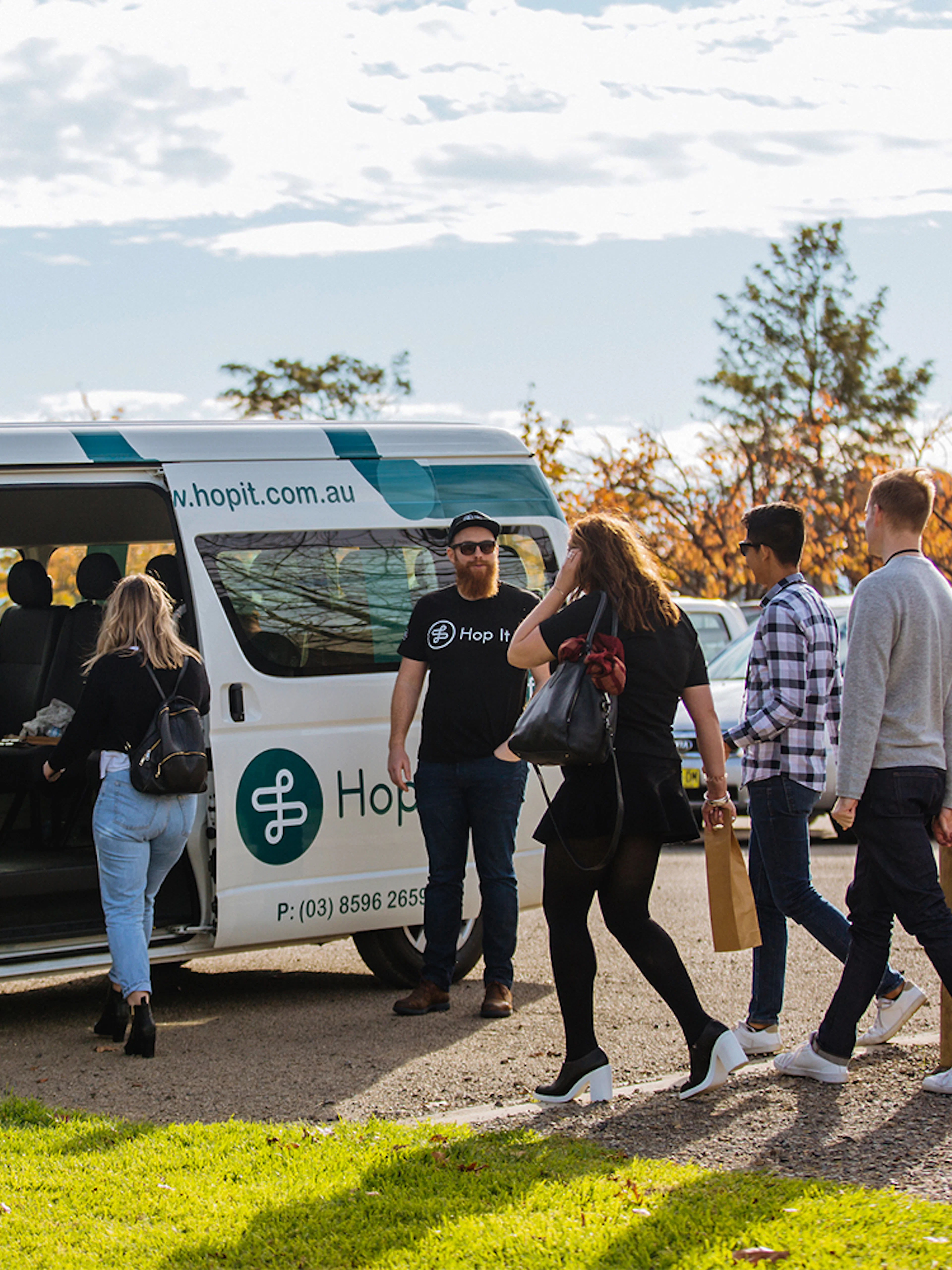 Yarra Valley hop-on-hop-off bus with passengers boarding in Melbourne.