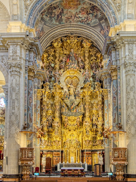 Seville Cathedral ornate altar with intricate carvings and golden details.
