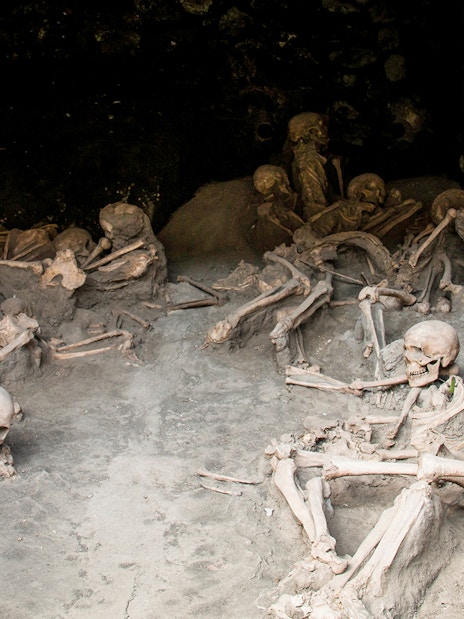 Skulls and skeletons at Herculaneum ruins excavation site, Naples.