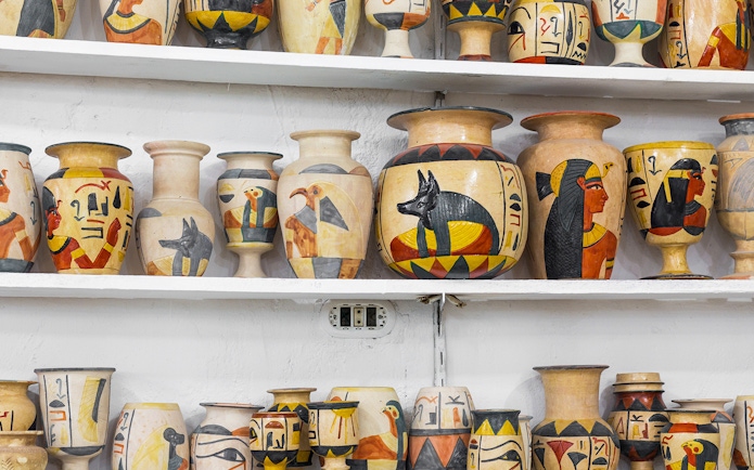 Ceramic vases with Egyptian motifs displayed at Khan El Khalili Bazaar, Cairo.