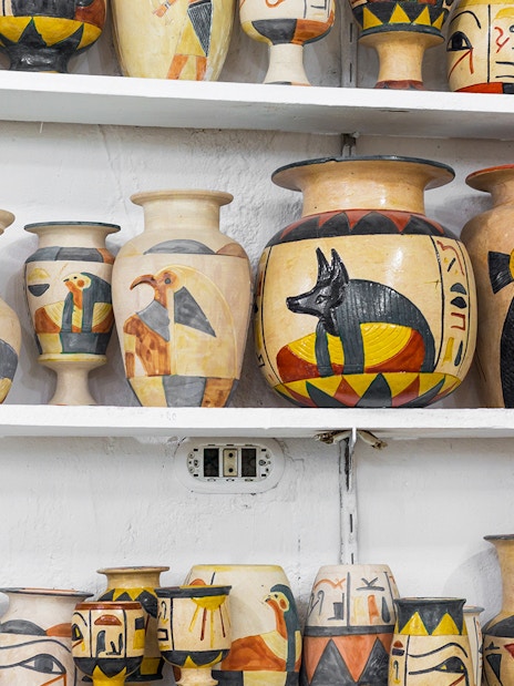 Ceramic vases with Egyptian motifs displayed at Khan El Khalili Bazaar, Cairo.