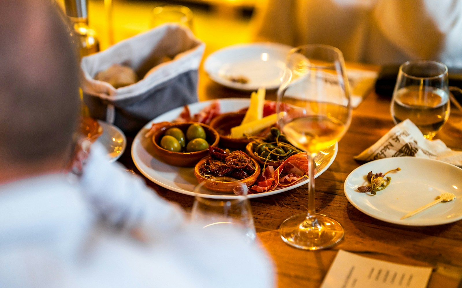 Tapas and drinks on a table during a guided tour.
