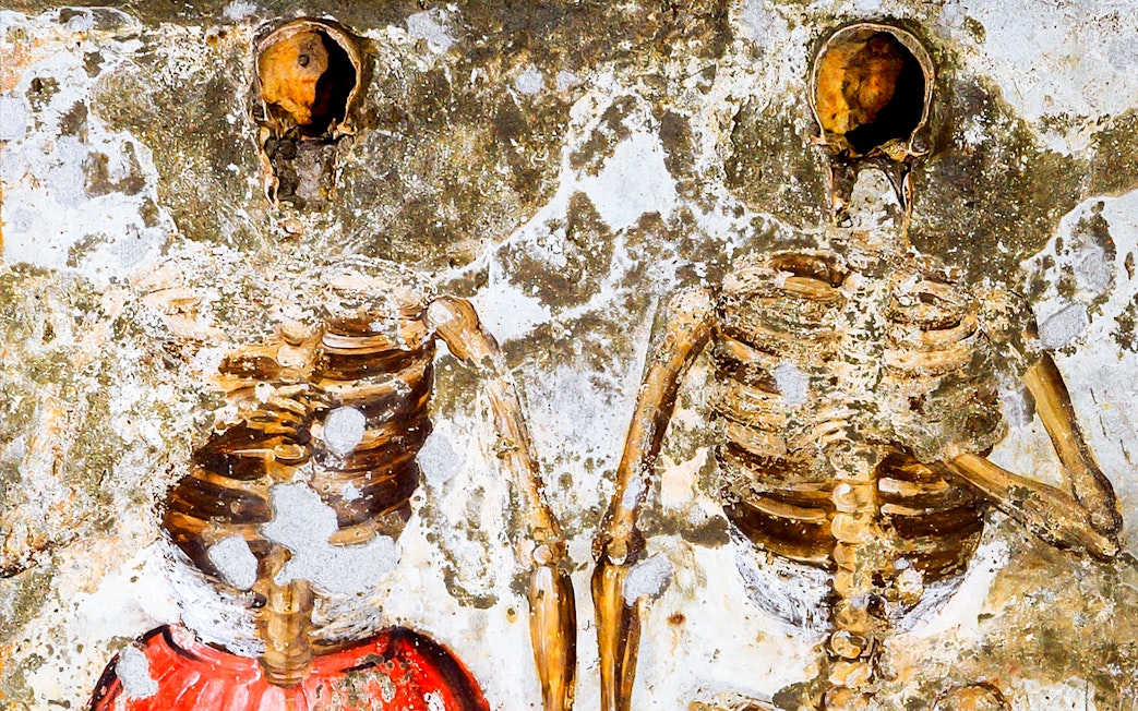 Skeletons embedded in the wall at Catacombs of San Gaudioso, Naples.