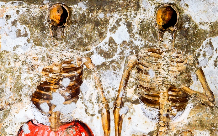 Skeletons embedded in the wall at Catacombs of San Gaudioso, Naples.