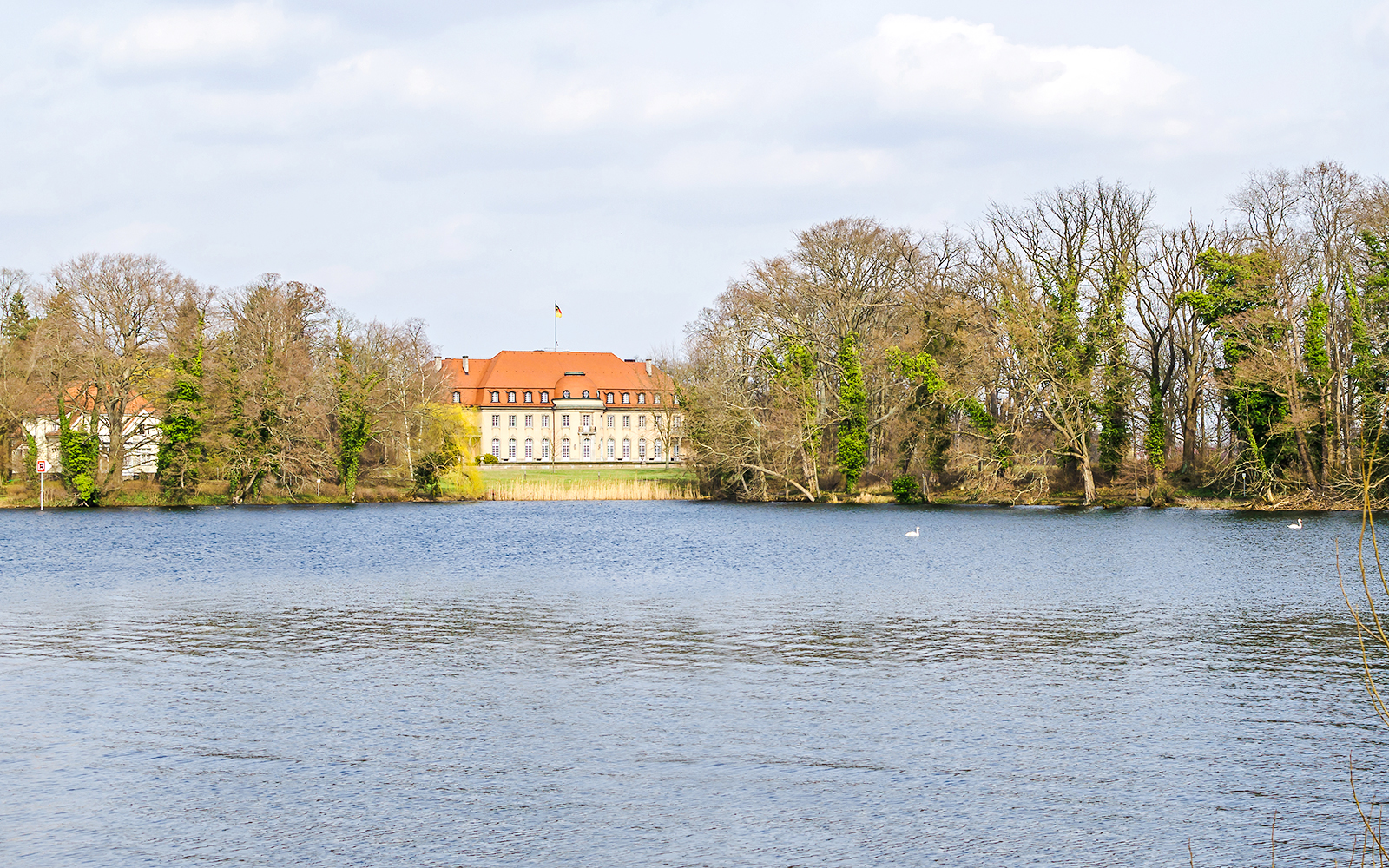 Borsig Villa by Lake Tegel surrounded by trees in Berlin, Germany.