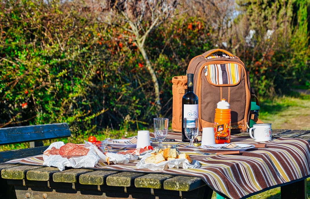 Picnic setup with food and drinks on a table during Loch Ness day tour from Edinburgh.