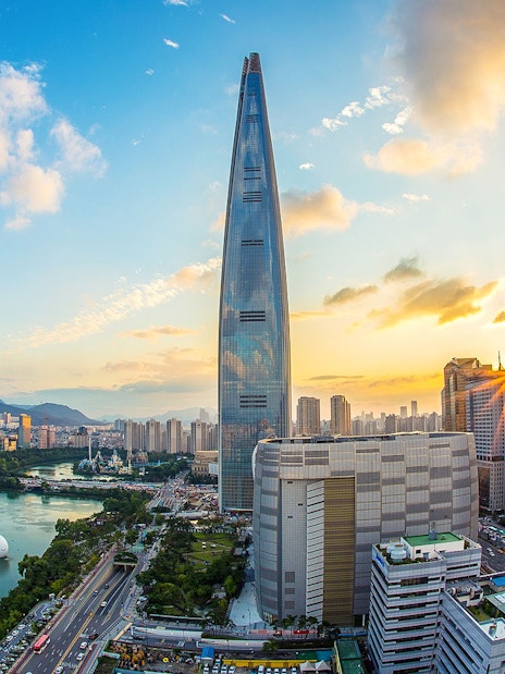 Lotte World Tower and Seoul skyline at sunset, South Korea.