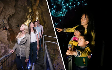 Visitors exploring Waitomo Glowworm Caves, observing glowworms illuminating the cave walls.