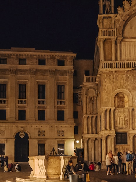 St. Mark's Basilica exterior at night during exclusive after-hours tour in Venice.