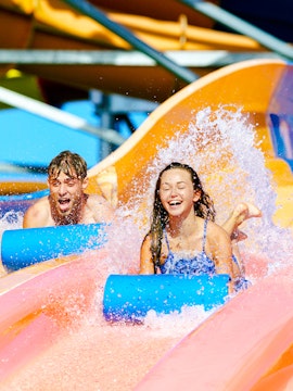 Children enjoying waterslides at Whitewater World, Gold Coast.
