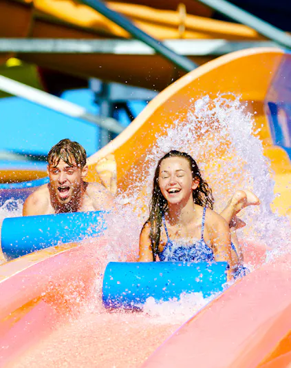Children enjoying waterslides at Whitewater World, Gold Coast.
