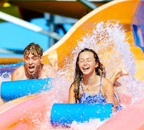 Children enjoying waterslides at Whitewater World, Gold Coast.