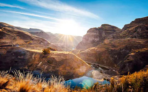 Sunrise over Q’eswachaka Inca Bridge and surrounding landscape, Cusco day trip.