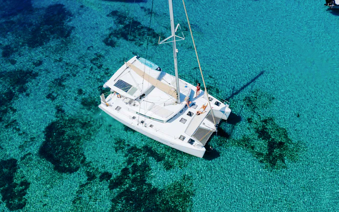 Lagoon 420 catamaran sailing in clear waters of Athens Riviera.