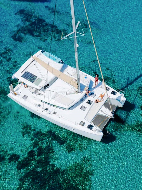 Lagoon 420 catamaran sailing in clear waters of Athens Riviera.