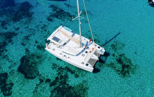 Lagoon 420 catamaran sailing in clear waters of Athens Riviera.