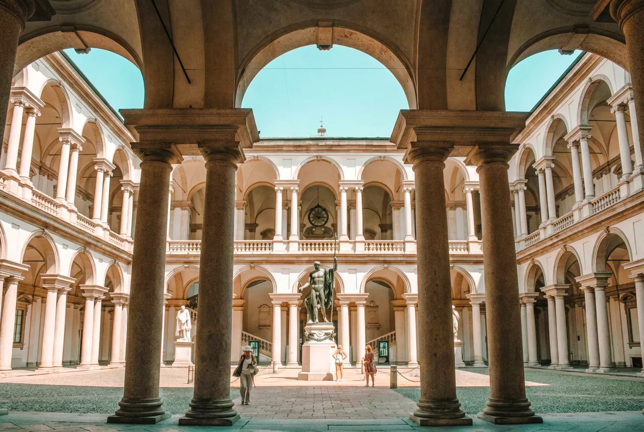 Brera Gallery courtyard with statue and arches, Milan.