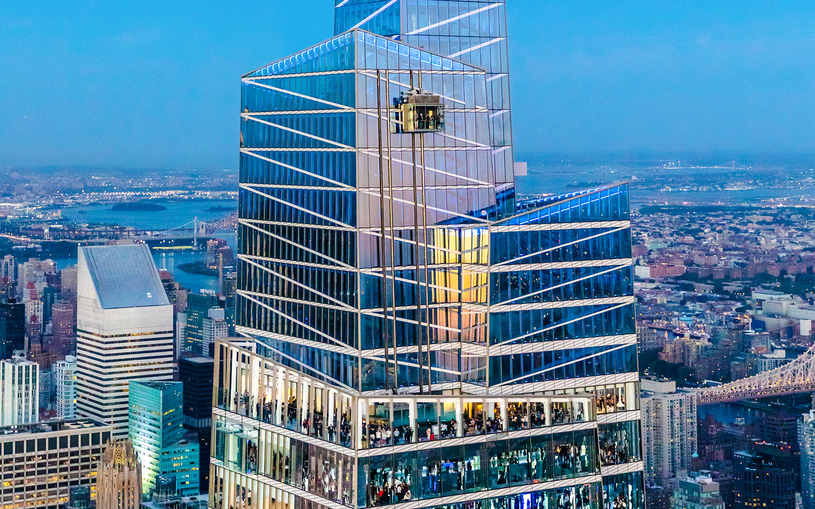 Summit One Vanderbilt exterior with city skyline in New York City.