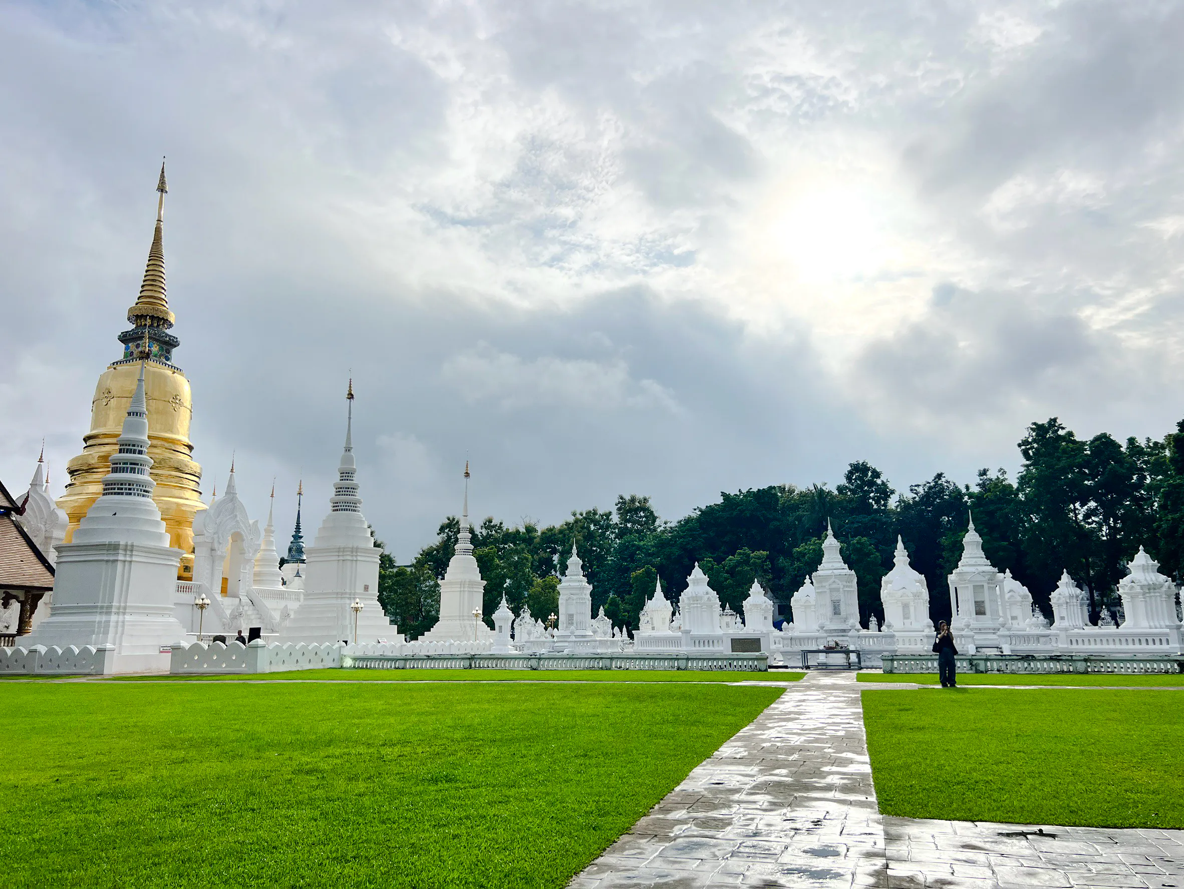 White stupas and golden pagoda at Wat Suan Dok, Chiang Mai.