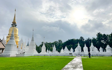 White stupas and golden pagoda at Wat Suan Dok, Chiang Mai.