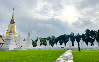 White stupas and golden pagoda at Wat Suan Dok, Chiang Mai.